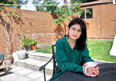 Sabina Saeed Kidney patient Sabina sitting at a table in her garden.